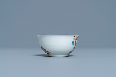 A Chinese export porcelain cup and saucer with a seamstress, Qianlong