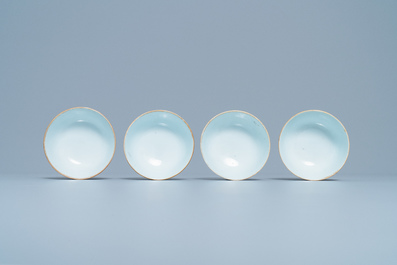 Four Chinese gilt-decorated blue-ground cups and saucers with fine landscapes, Qianlong