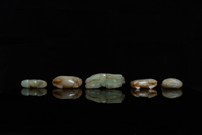 Five Chinese celadon and russet jade carvings, 19th C.