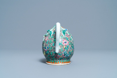 A Chinese famille rose peach-shaped 'cadogan' teapot with applied floral design, Qianlong