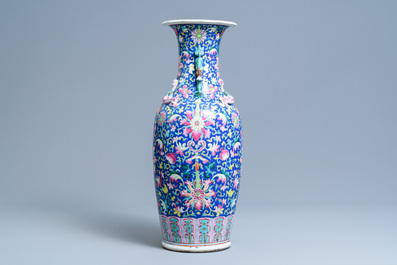 A Chinese famille rose blue-ground vase, 19th C.