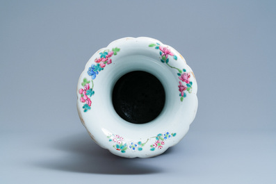 A Chinese famille rose blue-ground vase, 19th C.