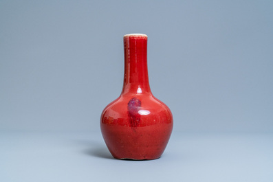 A Chinese monochrome sang de boeuf-glazed bottle vase, 19th C.