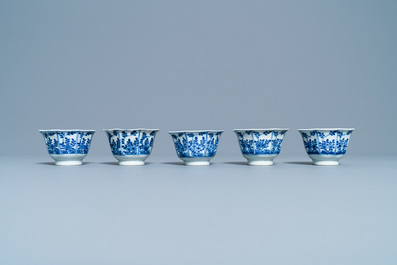 Five Chinese blue and white cups and saucers, Kangxi mark, 19th C.