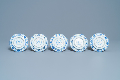 Five Chinese blue and white cups and saucers, Kangxi mark, 19th C.