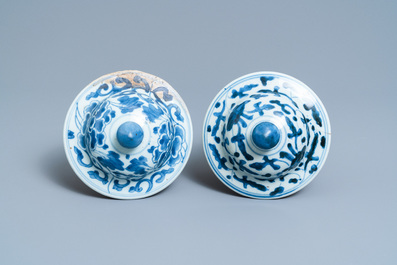 A pair of Chinese blue and white 'lotus scroll' vases and covers, Kangxi