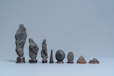 Eight Chinese scholar's rocks on wooden stands, 19/20th C.
