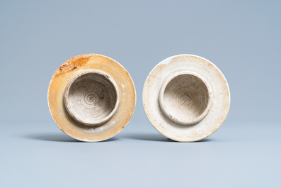 A pair of Chinese blue and white 'lotus scroll' vases and covers, Kangxi