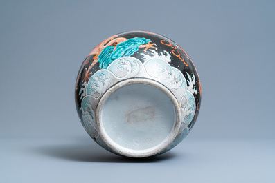 A Chinese famille noire 'dragon' bottle vase, 19th C.