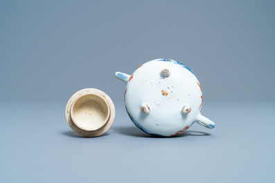 A Chinese blue, white, iron red and gilt tripod teapot and cover, Kangxi
