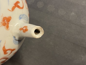 A Chinese blue, white, iron red and gilt tripod teapot and cover, Kangxi