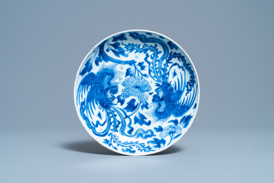 A Chinese blue and white 'phoenix' dish, a 'crab' bowl and a lotus-shaped bowl, Kangxi