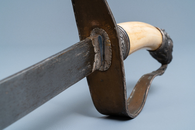 A Chinese or Vietnamese silver, tie li mu wood and bone sword, 19th C.