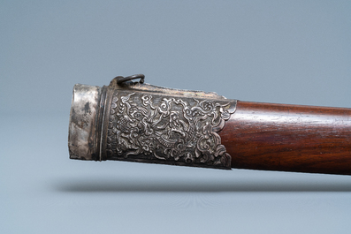 A Chinese or Vietnamese silver, tie li mu wood and bone sword, 19th C.