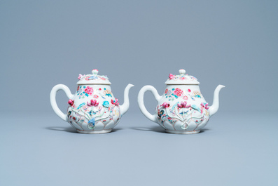 A pair of Chinese famille rose relief-decorated teapots and covers, Yongzheng
