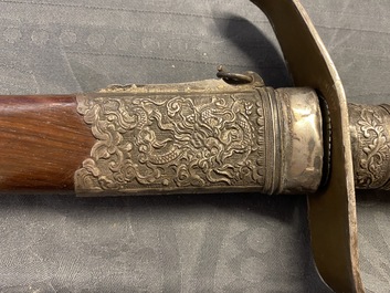 A Chinese or Vietnamese silver, tie li mu wood and bone sword, 19th C.