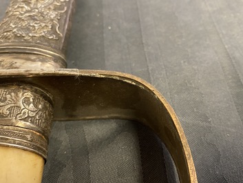 A Chinese or Vietnamese silver, tie li mu wood and bone sword, 19th C.