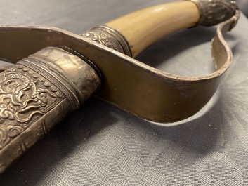 A Chinese or Vietnamese silver, tie li mu wood and bone sword, 19th C.