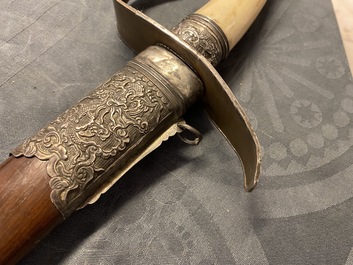 A Chinese or Vietnamese silver, tie li mu wood and bone sword, 19th C.