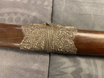 A Chinese or Vietnamese silver, tie li mu wood and bone sword, 19th C.