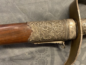 A Chinese or Vietnamese silver, tie li mu wood and bone sword, 19th C.