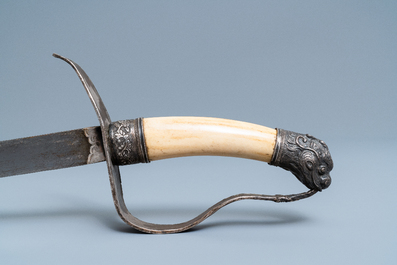 A Chinese or Vietnamese silver, tie li mu wood and bone sword, 19th C.
