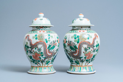 A pair of Chinese famille verte 'dragon' vases and covers, 19th C.