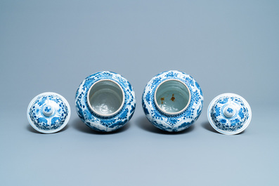 A pair of Chinese blue and white 'hunting scene' jars and covers, Kangxi
