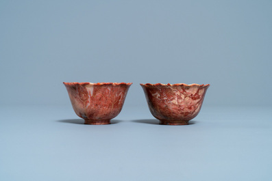 A pair of Chinese Shoushan soapstone gilt-decorated engraved cups and saucers, Kangxi
