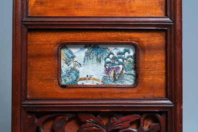 A Chinese carved wooden panel with landscape plaques, 19/20th C.