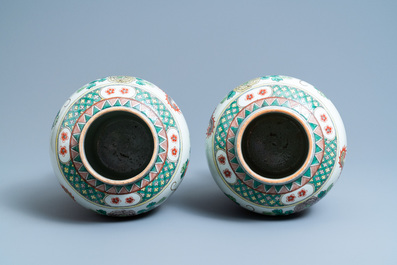 A pair of Chinese famille verte 'dragon' vases and covers, 19th C.