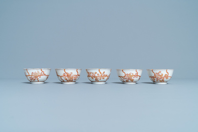 Five Chinese iron red and gilt cups and saucers, Yongzheng/Qianlong