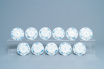 Eleven Chinese blue and white lobed cups and saucers, Kangxi
