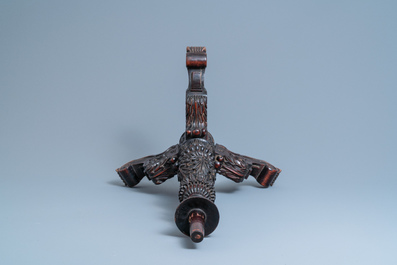 A Chinese carved wooden table with a large Canton famille verte plaque, 19th C.