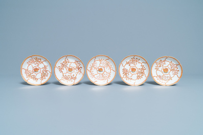 Five Chinese iron red and gilt cups and saucers, Yongzheng/Qianlong