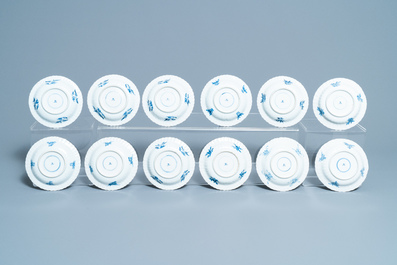 Seventeen Chinese blue and white cups and twenty-two saucers with floral design, Kangxi