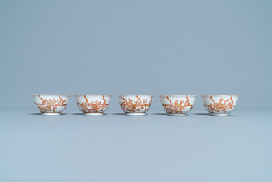 Five Chinese iron red and gilt cups and saucers, Yongzheng/Qianlong