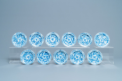 Eleven Chinese blue and white lobed cups and saucers, Kangxi