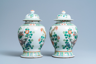 A pair of Chinese famille verte 'dragon' vases and covers, 19th C.