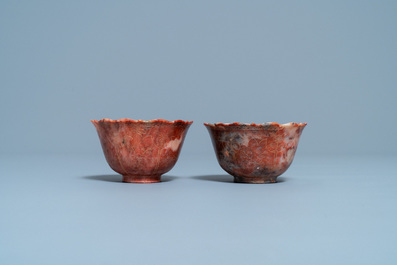 A pair of Chinese Shoushan soapstone gilt-decorated engraved cups and saucers, Kangxi