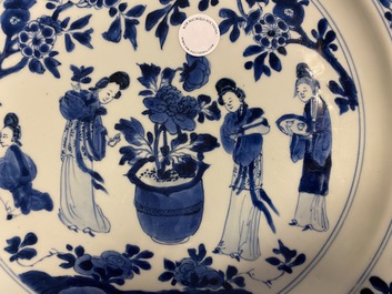 A Chinese blue and white dish with ladies around a jardini&egrave;re, Kangxi