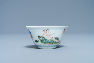 A Chinese famille verte 'erotical subject' cup and saucer, Kangxi