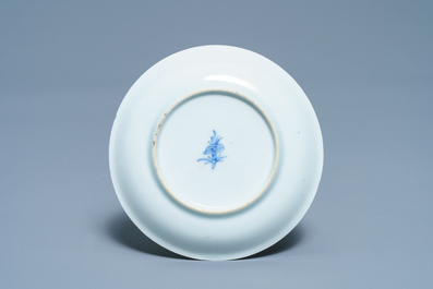 A Chinese famille verte 'erotical subject' cup and saucer, Kangxi