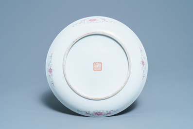 A Chinese famille rose 'dragon and phoenix' yellow-ground dish, Qianlong mark, Republic