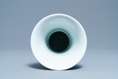 A Chinese blue and white 'gu' vase with figurative design, Kangxi