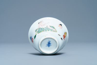 A Chinese famille verte 'erotical subject' cup and saucer, Kangxi