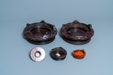 Six Chinese famille rose vases and various wooden stands and covers, 19/20th C.