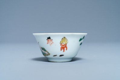 A Chinese famille verte 'erotical subject' cup and saucer, Kangxi