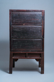 A Chinese hongmu cupboard with a blue and white 'Buddhist lions' plaque, 19th C.