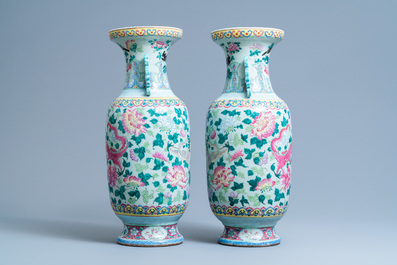 A pair of Chinese famille rose celadon-ground 'dragon' vases, 19th C.